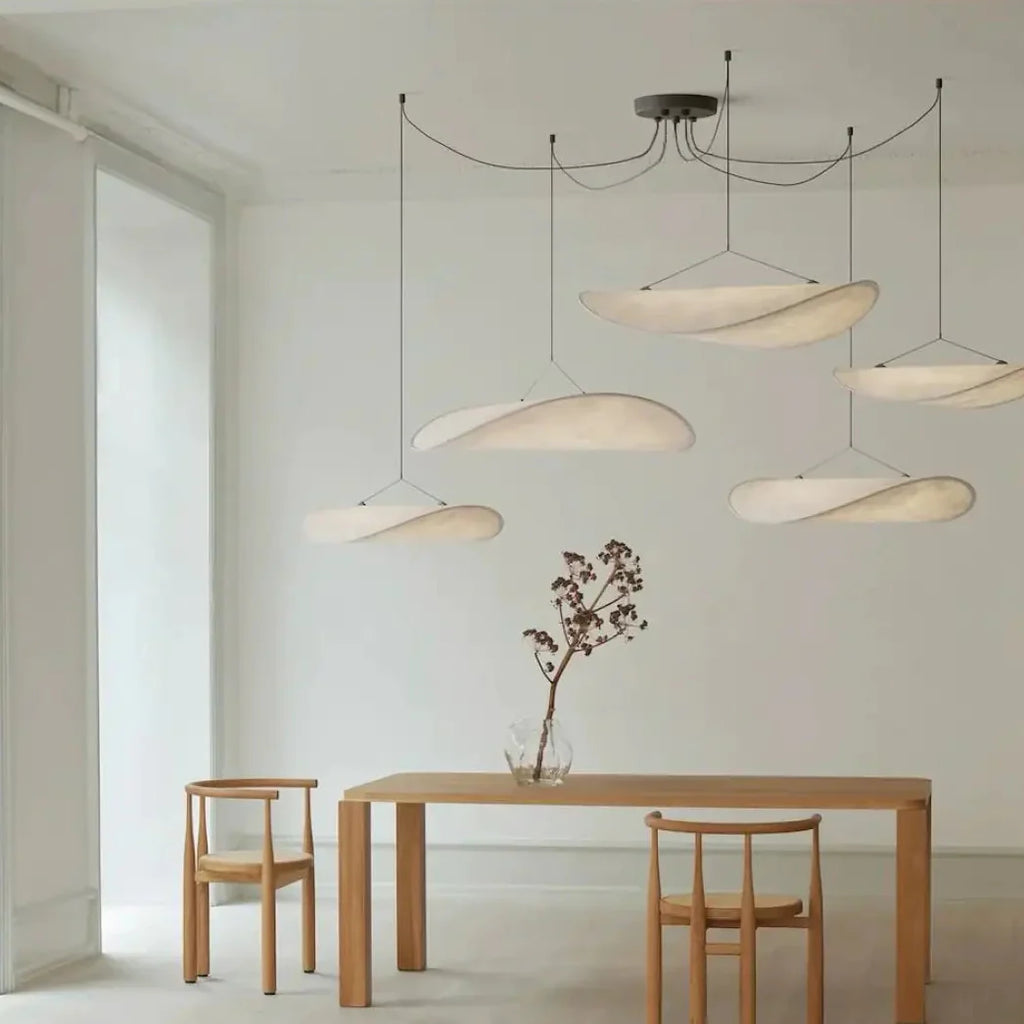 AKARI Pendant Light close-up – diffusing textile shade texture, soft ambient glow, black metal