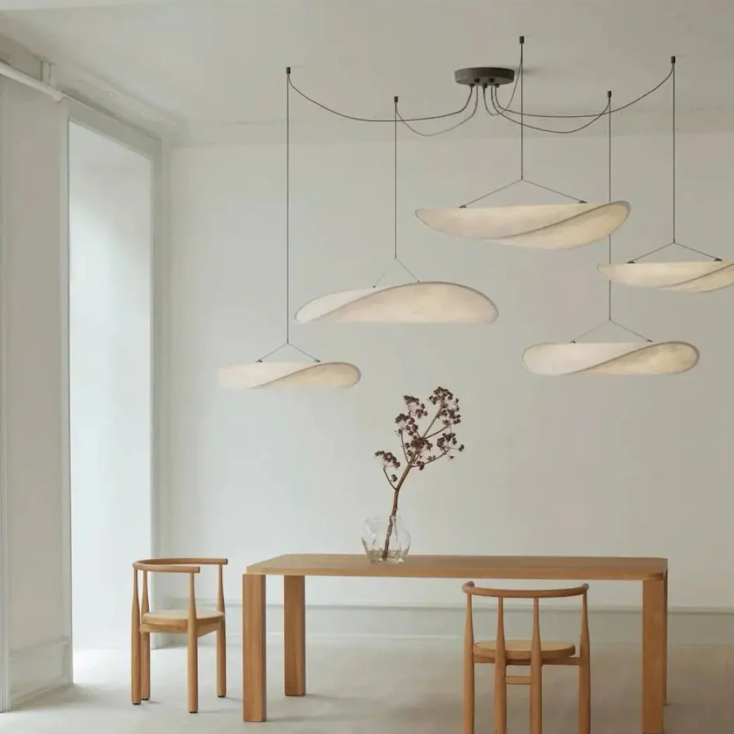 AKARI Pendant Light close-up – diffusing textile shade texture, soft ambient glow, black metal