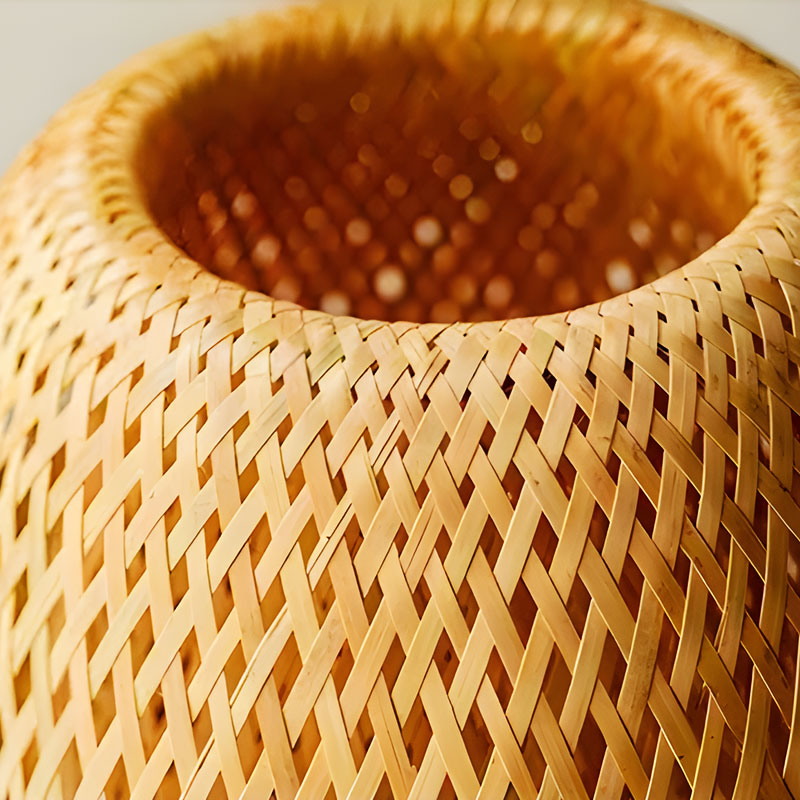 AKARI Rattan Lamp close-up – hand-woven rattan texture, natural shadow patterns, warm light