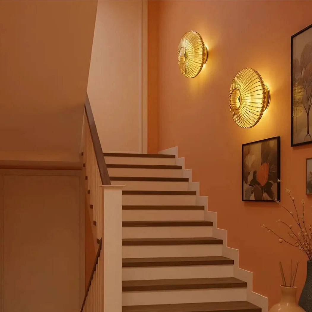 HALO Round Wall Light in bedroom – bedside sconce, circular hand-blown glass, brushed brass fitting